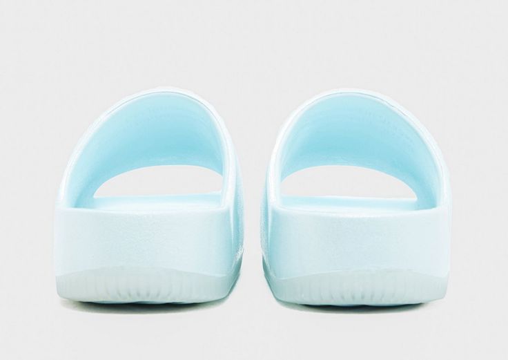 Off-dutys are made better when you slip on these women's Calm Slides from Nike. In a Glacier Blue colourway, these simple slides have a water-friendly outer foam and a contoured design for a smooth, seamless feel. Undefoot, the textured footbed keeps your foot in place, while the rubber outsole offers essential grip on slippery surfaces. Finished off with a debossed Swoosh to the side. Slides Women, Blue Nike, Jd Sports, Textures Patterns, Slides, Slip On, Things To Come, Nike, Sports