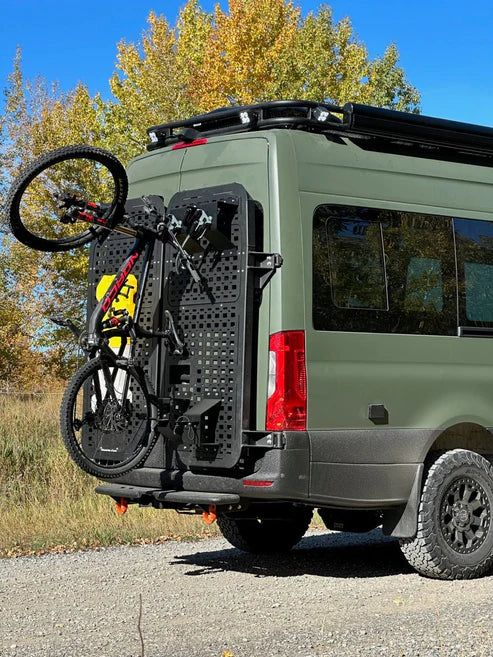 a green van with a bike on the back