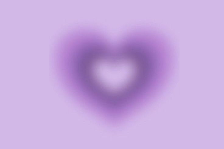 a heart shaped object on a purple background