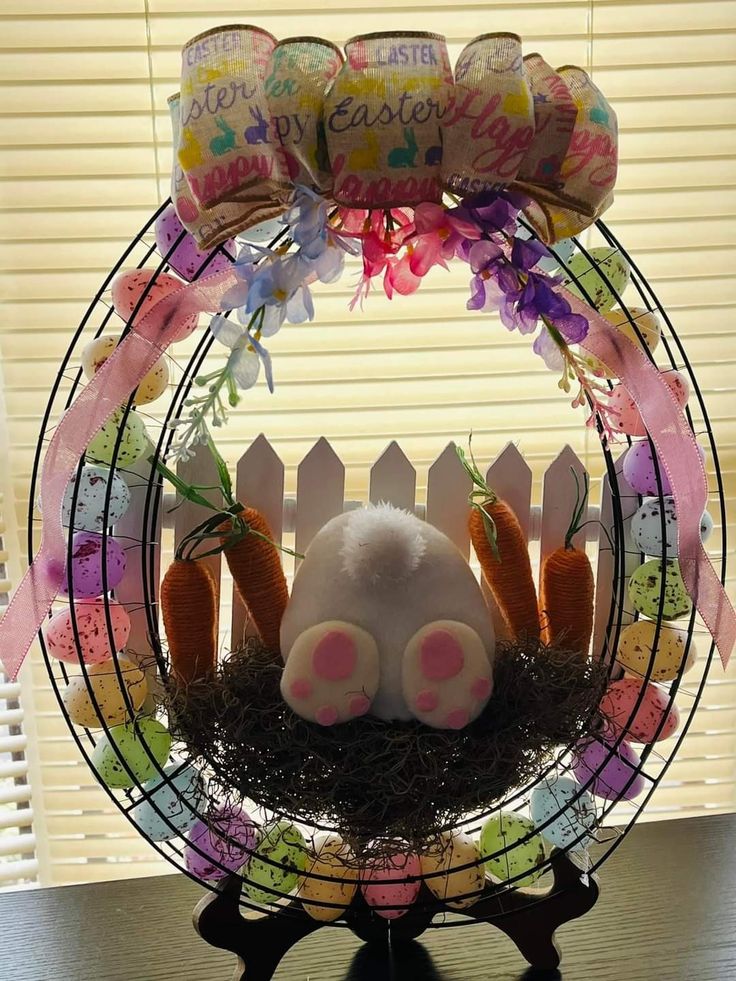 an easter decoration with bunny ears and carrots