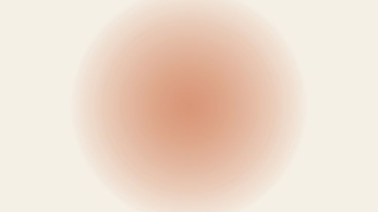 an orange and white circle on a beige background