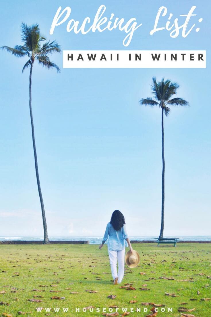 a woman walking in the grass with palm trees behind her and text packing list hawaii in winter