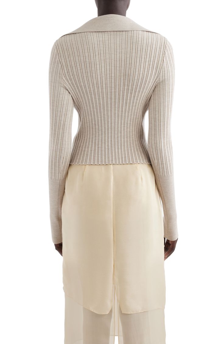 Dramatically elongated cuffs and a deeply cut neckline bring the French label's signature sophistication to a polo-style sweater knit from a rich wool blend. 22 1/2" length (size Medium) Button half-placket Spread collar Long sleeves with ribbed cuffs 91% wool, 7% polyamide, 2% elastane Dry clean Made in Italy Designer Clothing Elegant Ribbed Merino Wool Tops, Chic Wool Sweater With Ribbed Collar, Elegant Turtleneck Cardigan For Spring, Fitted Ribbed Beige Cardigan, Elegant Spring Turtleneck Cardigan, Chic Long-sleeved Textured Knit Polo Sweater, Fitted Ribbed Cashmere Sweater, Fitted Merino Wool Long Sleeve Polo Sweater, Fitted Long Sleeve Merino Wool Polo Sweater