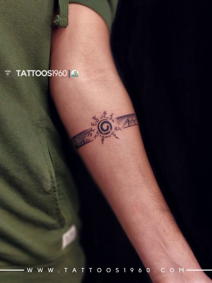 a man with a tattoo on his arm holding onto another person's arm and looking at the camera