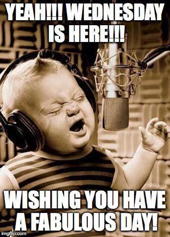 a baby with headphones on singing in front of a microphone that says yeah wednesday is here wishing you have a fabulous day