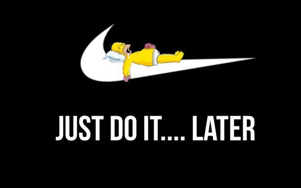 a man laying on top of a white nike logo with the words just do it later