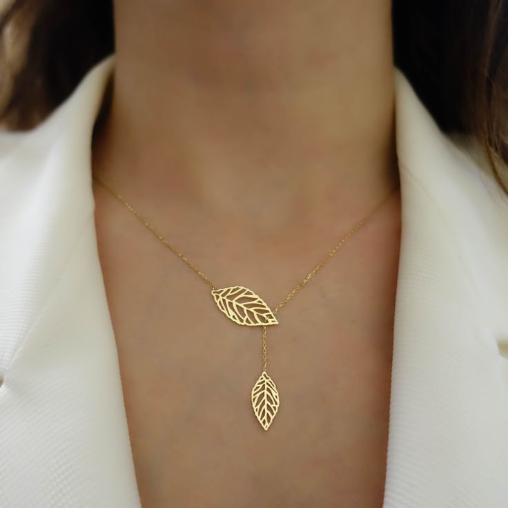 "\"Double Leaf Gold Necklace | Mother of Nature, Leaves of Tree Golden Pendant | Outline Hollow Leaves | Elegant Design | Gift for Her\" Perfect gift for your girlfriend, feyonce, wife, mother, daughter and for you best friend It can be gifted in anniversary, birthday, graduation, baby shower, and similar occasions. * Material: 14k Yellow Gold, 14k Rose Gold, 14k White Gold * Leaf Size (On Top): 0,87\" x 0,43\" // 22mm x 11mm (±5%) * Necklace Length: 14\" - 20\" // 35,6cm - 50,8cm (Please contac Elegant Rose Gold Leaf Jewelry, Elegant Leaf-shaped Wedding Jewelry, 14k Rose Gold Necklaces For Jewelry Making, Gold Plated Lariat Jewelry For Wedding, Gold Plated Lariat Jewelry For Gifts, 14k Gold Lariat Fine Jewelry, Handmade Yellow Gold Lariat Jewelry, Minimalist Yellow Gold Leaf Jewelry, 14k White Gold Filled Necklace For Anniversary