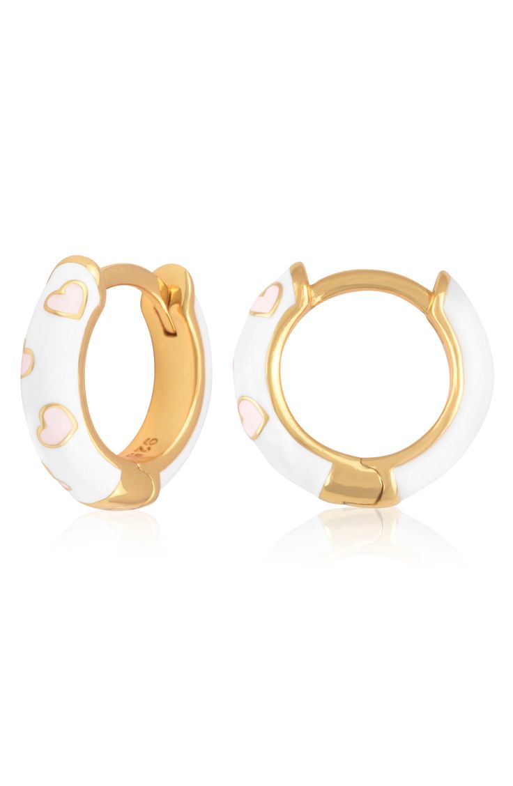 Easy-to-wear hoop earrings will add significant polish to even your most casual ensembles. 1/2" drop; 1/8" width Hinge with snap-post closure Sterling silver with goldtone plate/enamel Imported Enamel Huggie Jewelry Gift, Enamel Huggie Earrings Perfect For Gifts, Nickel-free White Huggie Earrings, Round Huggie Earrings For Valentine's Day, Trendy Enamel Hoop Jewelry, Trendy White Huggie Earrings For Everyday, Everyday Trendy White Huggie Earrings, Valentine's Day Round Huggie Earrings, White Small Hoop Huggie Earrings As A Gift