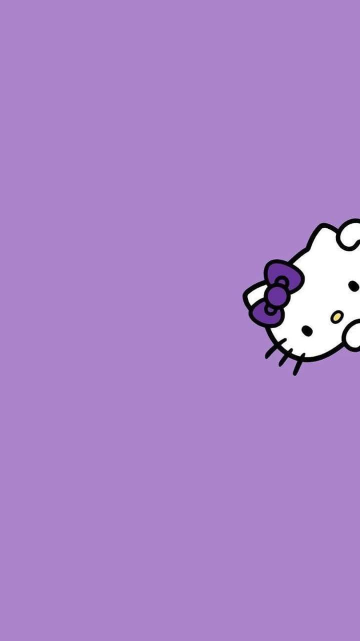 a hello kitty wallpaper with purple background