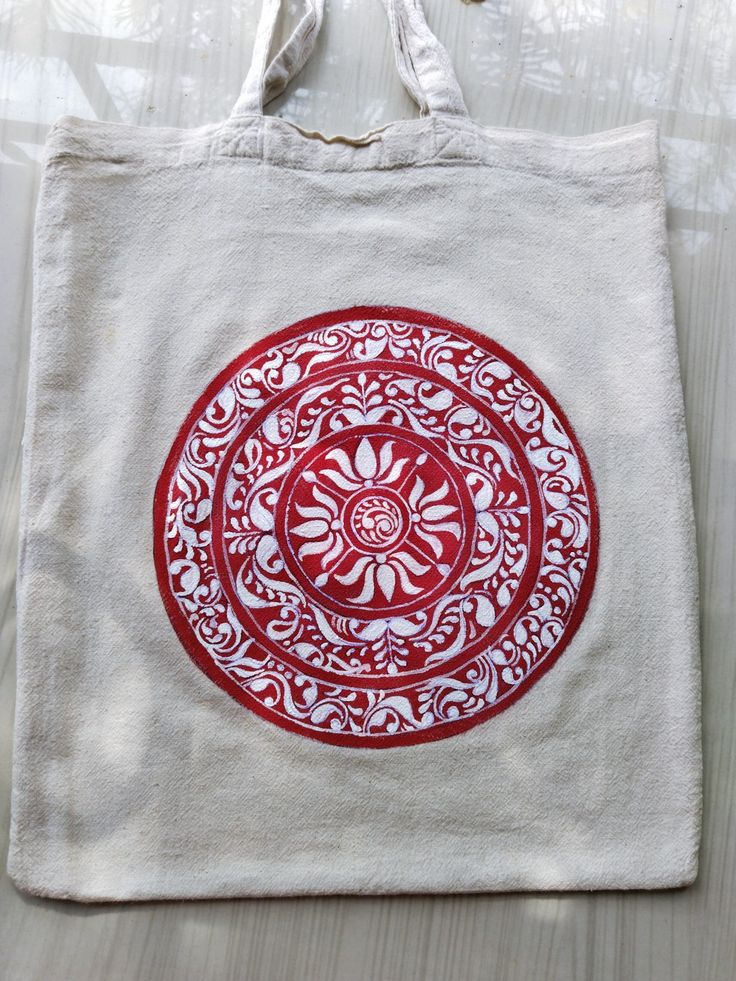 a red and white bag sitting on top of a table