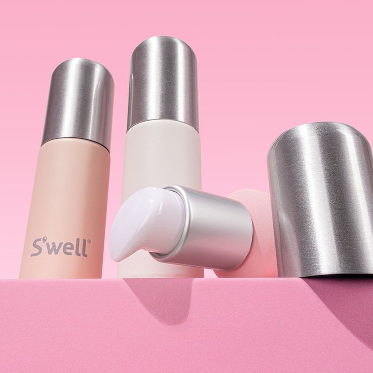 three different types of beauty products on a pink surface with the word swell written in white