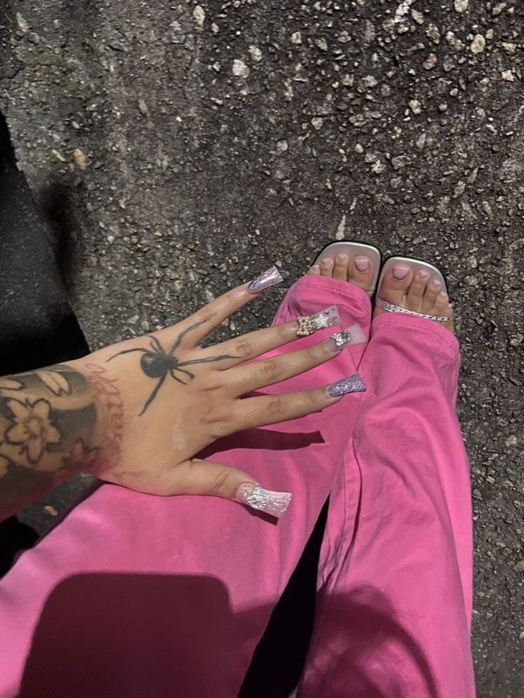 a person with tattoos on their arms and feet