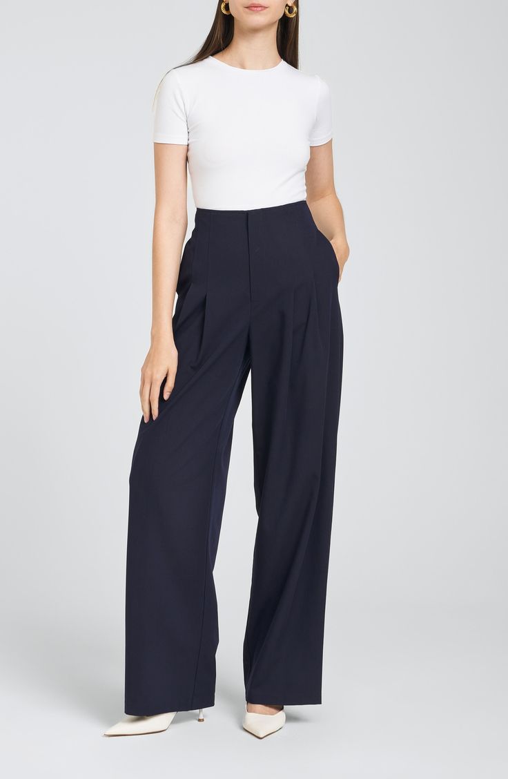 Tidy lines of stitching transition into relaxed pleats on these high-rise pants that are a versatile choice for your office ensembles. 30 1/2" inseam; 23" leg opening; 13" front rise; 15 1/2" back rise (size Medium) Zip fly with hidden button closure Side-seam pockets 73% polyester, 17% rayon, 7% wool, 3% elastane Hand wash, line dry Imported Business Casual Pleated Wide-leg Pants, Business Casual Wide-leg Pleated Pants, Modern Pleated Pants For Workwear, Tailored Wide Leg Career Pants, Wide-leg Pants For Business In Spring, Business Wide-leg Pants For Spring, Modern Pleated Pants For Business Casual, High Waist Pleated Formal Pants, Relaxed Fit Wide Leg Office Pants