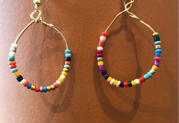 super cute hoop earring with rainbow small beads Hoop Earrings With Tiny Beads, Adjustable Rainbow Jewelry With Tiny Beads, Multicolor Metal Dangle Hoop Earrings, Adjustable Hoop Earrings With Tiny Beads, Nickel-free Summer Jewelry, Colorful Adjustable Jewelry With Tiny Beads, Rainbow Nickel-free Drop Earrings, Colorful Adjustable Tiny Beads Jewelry, Nickel-free Rainbow Drop Earrings