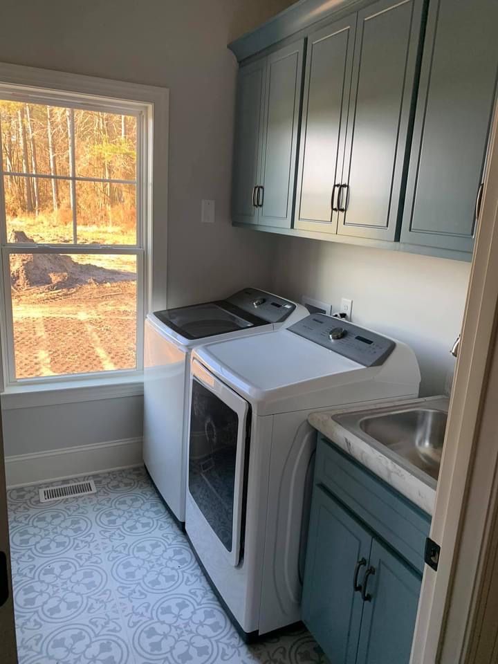 a washer and dryer in a small kitchen