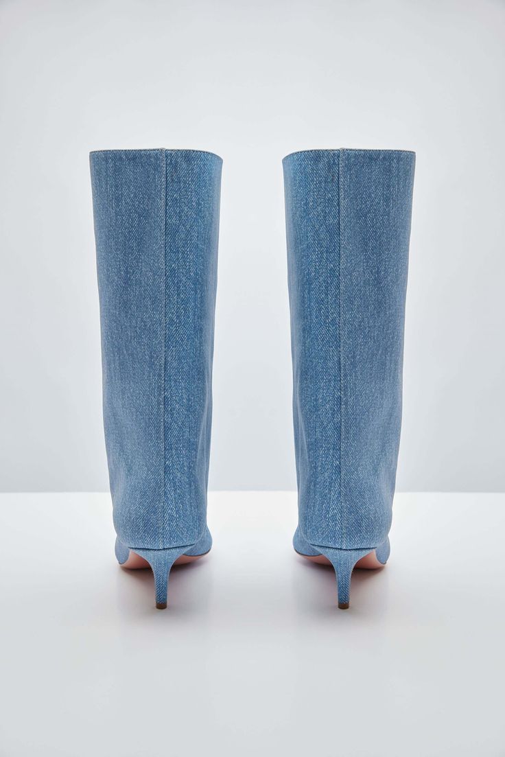 For Spring/Summer 2024, Amina Muaddi played with the idea of trompe l'œil by crafting a pair of thigh-high suede boots with a denim print. Spring Denim Knee-high Boots, Spring Knee-high Denim Boots, Denim Knee-high Boots For Spring, Fitted Denim Boots With Pointed Toe, Fitted Denim Boots For Spring, Denim Summer Boots, Chic Denim Blue Boots For Spring, Fitted Denim Knee-high Boots, Fitted Denim Summer Boots