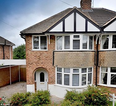 a large brick house with white trim and windows