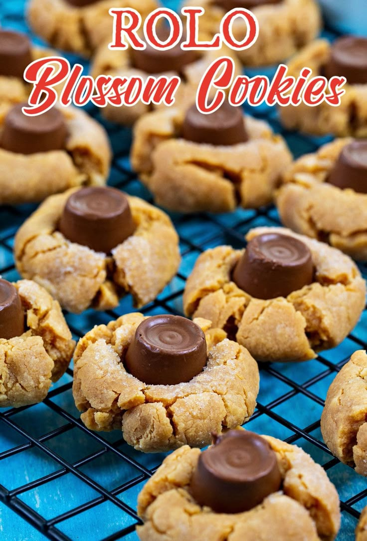 chocolate chip cookies on a cooling rack with the words rolo blossom cookies above them