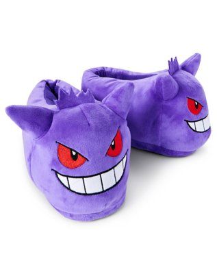 a pair of purple slippers with red eyes and fangs on the front, sitting next to each other