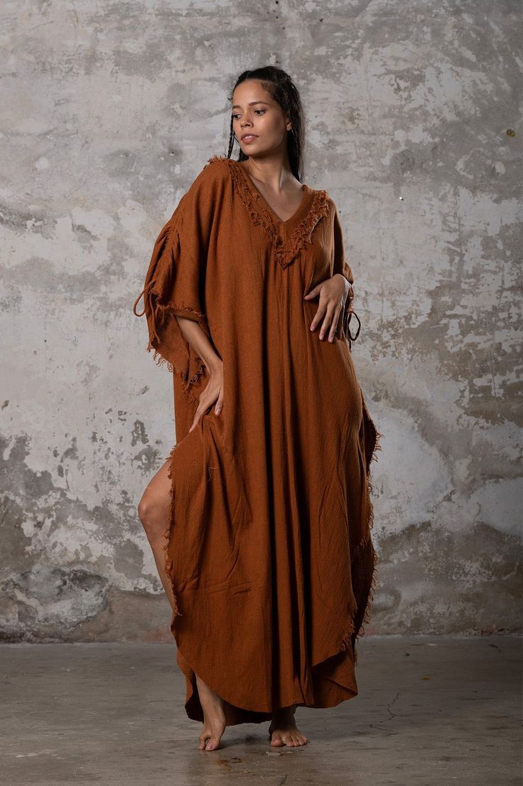 PUSKUL Kaftan embodies the essence of boho-chic, a natural and ethereal dress that effortlessly combines comfort and style. Crafted from the softest cotton available, this dress will envelop your skin like a gentle, warm embrace. PUSKUL Kaftan is versatile and can be worn on any occasion, from the dance floors to formal events, street wear to desert outfits. You can also wear it in two distinct styles: as a kaftan or as a sultry dress, simply by changing the way you put it on! Puskul Kaftan is e Beach Maxi Dress With Natural Dye, Elegant Cotton Beach Kaftan, Elegant Cotton Kaftan For The Beach, Bohemian Tunic Linen Dress, Bohemian Style Long Linen Summer Dress, Bohemian Long Linen Dress For Summer, Bohemian Long Linen Summer Dress, Summer Bohemian Long Linen Dress, Flowy Bohemian Maxi Linen Dress