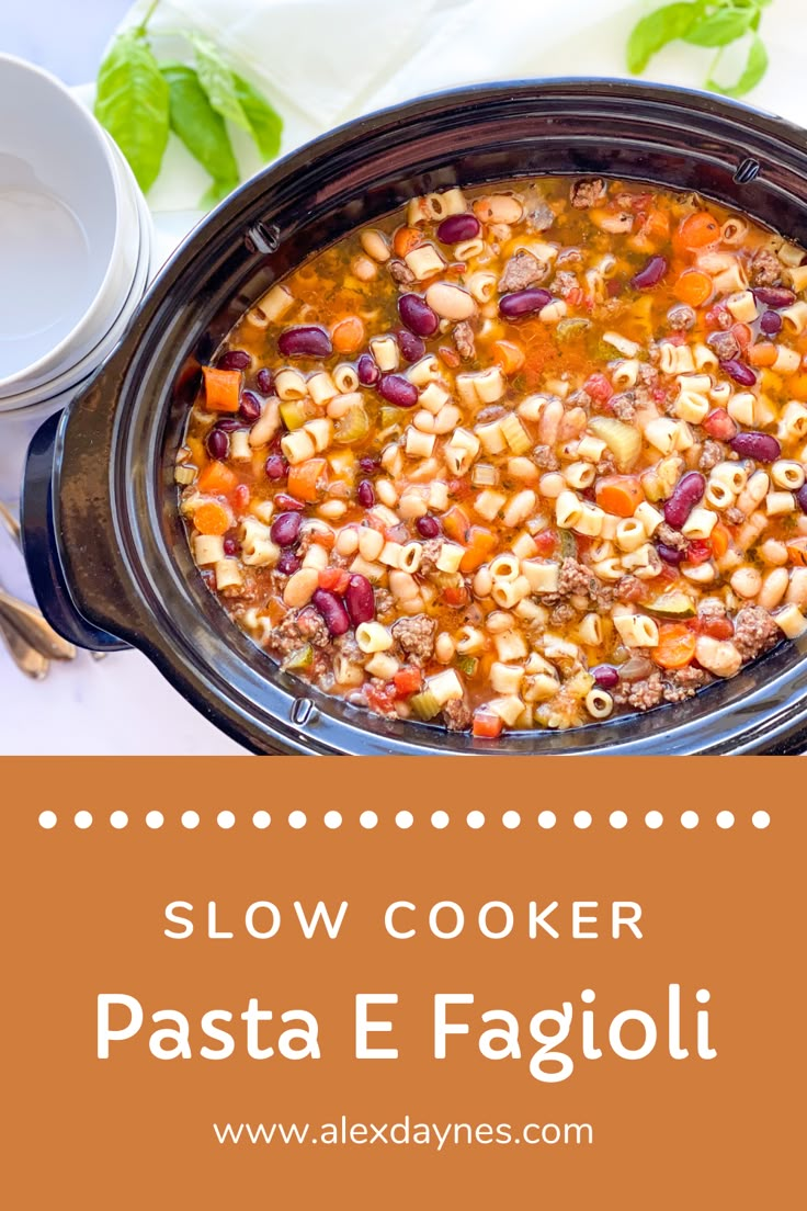 slow cooker pasta e fagioi in a crock pot on a table