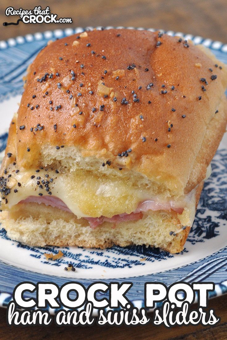 a close up of a sandwich on a plate with the words crock pot ham and swiss sliders