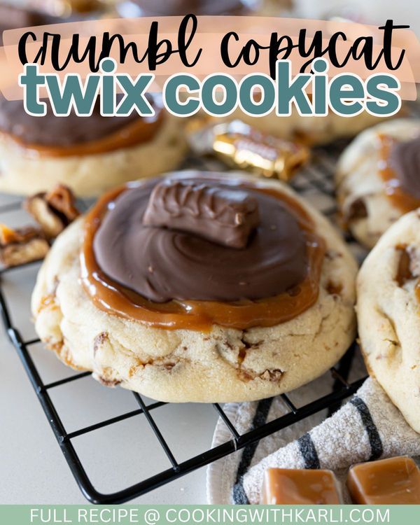 cookies with chocolate frosting and caramel drizzled on top, sitting on a cooling rack