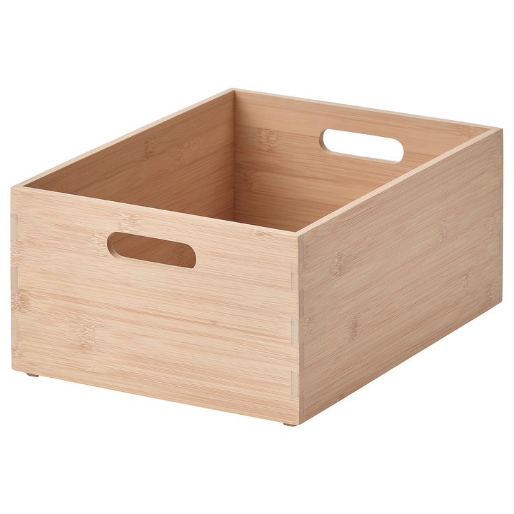 a wooden storage box with handles on an isolated white background