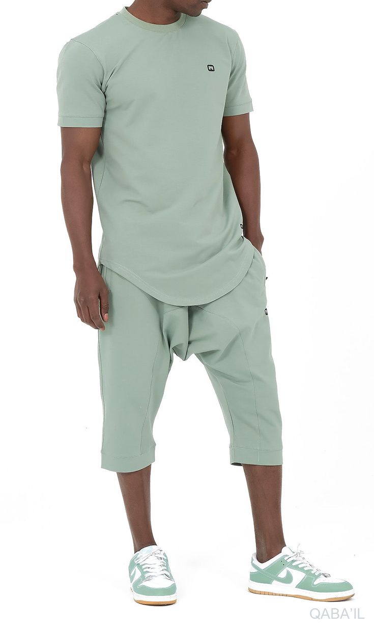 QL Relaxed Fit Nautik Set in Almond Green Description:Enjoy the warmth of summer with a fresh new look! This T-shirt and shorts set offers comfort, functionality and style. Featuring a shirt with a round neck and a stylish round hem and a three-quarter shorts that lets you enjoy the sun while keeping covered. This holiday wardrobe is all you need to feel at your best this season. Modern Islamic clothing for men Very high-quality fabric from top brands Short sleeved T-shirt with a small logo on the left chest Shorts with two zipped side pockets and elastic waist Modest Fashion Compliant (Halal Compliant) Details: Materials: 50% cotton; 40% polyester; 10% elastane Style: Casual, Sportswear and Events Care Tips: Wash at 30° Modern Islamic Clothing, Thank You Sister, Relaxed Trousers, Vans T Shirt, Urban Lifestyle, Islamic Clothing, Holiday Wardrobe, Enjoying The Sun, T Shirt And Shorts