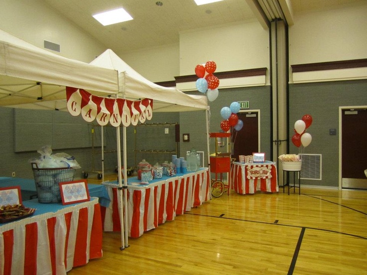 an indoor basketball court decorated with red, white and blue decorations for a party or celebration