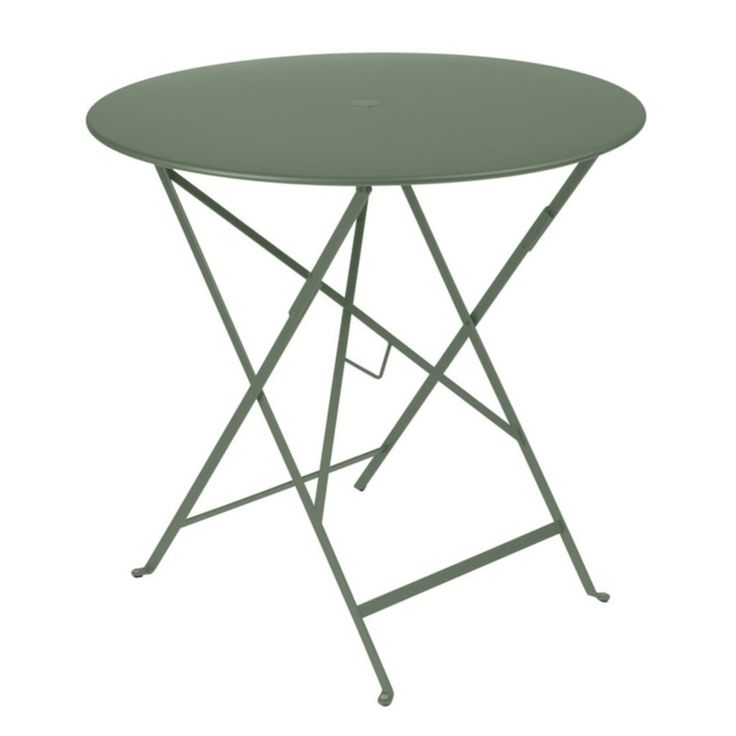 a round table with metal legs and a green plastic cover on the top, against a white background