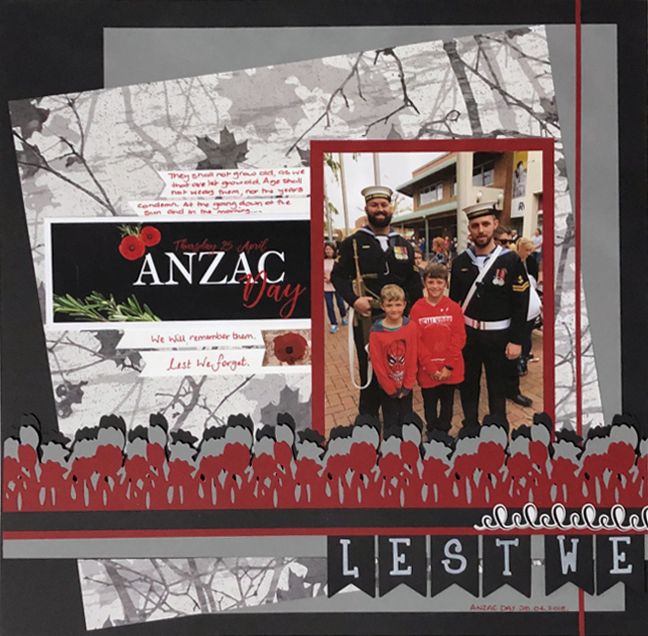 a scrapbook page with an image of two men and one boy in red jackets