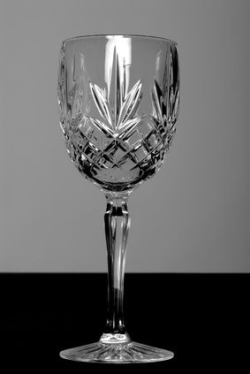 an empty wine glass sitting on top of a table