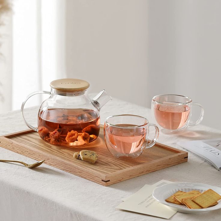 tea and crackers on a wooden tray