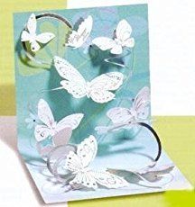 a pop up card with white butterflies on it