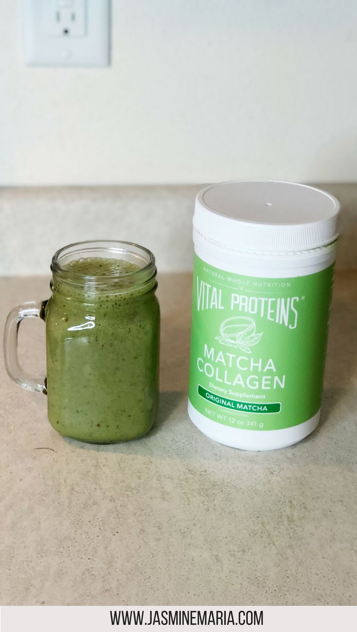 a green smoothie in a mason jar next to a container of matcha collagen