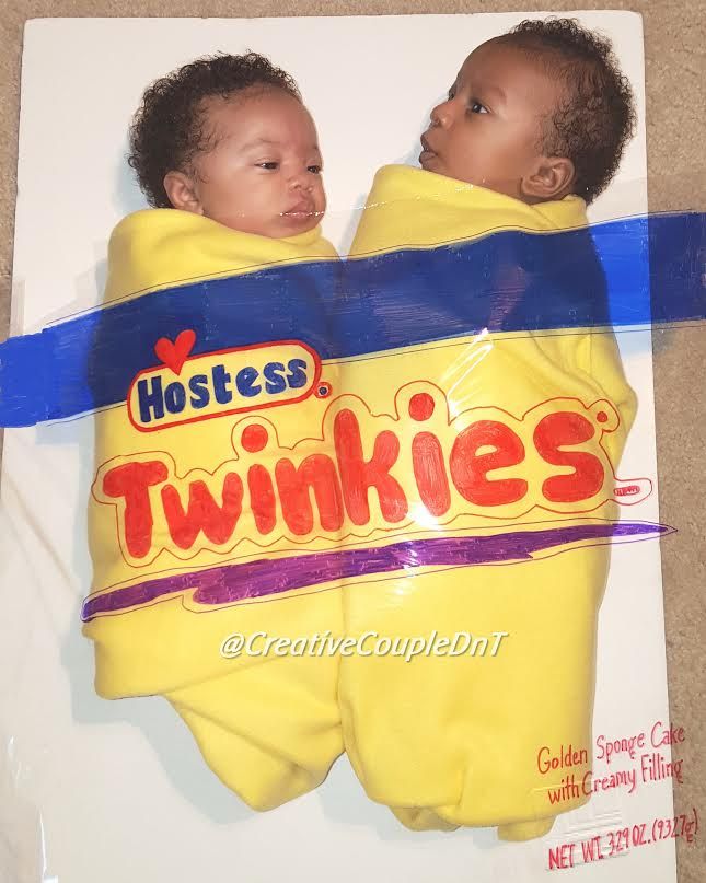 two babies wrapped in twinkies sitting on top of each other