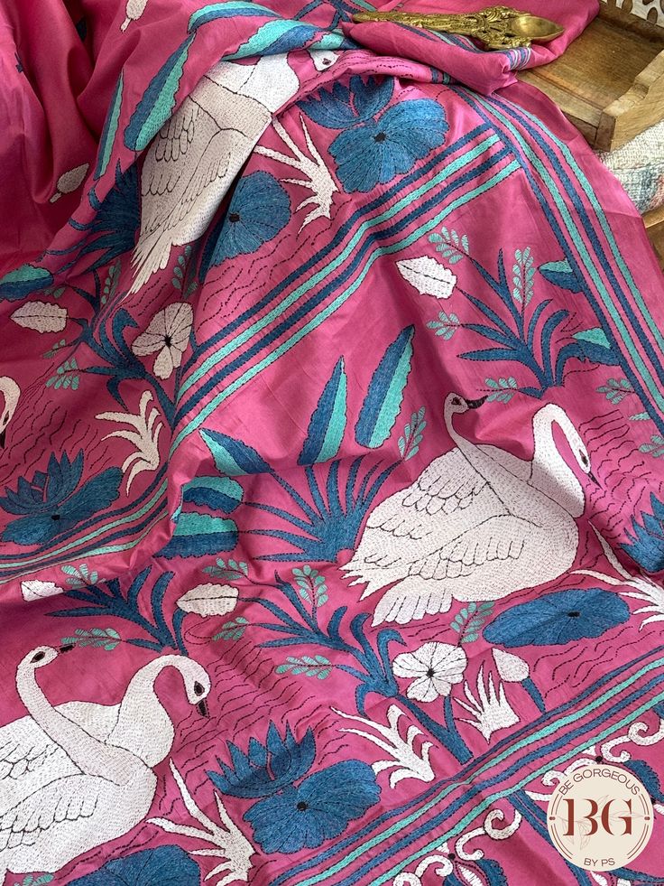 Indulge in luxury with our Kantha Stitch Saree on Bangalore Silk. This elegant pink saree is hand-stitched and made with the finest Bangalore silk, providing a delicate texture and luxurious feel. Perfect for any occasion, this saree is a must-have for those seeking sophisticated and exclusive fashion. Kantha Stitch on bangalore silk - pink Saree comes with a blouse piece. Fall and pico done. Fully stitched blouse shown in pictures is optional and can be purchased seperately from our blouses and croptops section. For saree video please connect with us on whatsapp @469-937-0606 Ready to be shipped in USA from San Diego, California. All pictures are original pictures. Colors may slightly vary due to pic resolution. Pink Embroidered Fabric For Navratri With Traditional Drape, Pink Embroidered Fabric For Navratri, Pink Embroidered Fabric With Cutdana In Traditional Drape, Pink Embroidered Fabric With Traditional Drape For Festive, Pink Embroidered Fabric With Pallu For Navratri, Pink Raw Silk Traditional Wear With Resham Embroidery, Pink Embroidered Fabric With Pallu For Diwali, Pink Traditional Drape Embroidered Fabric For Festive Occasions, Pink Traditional Wear With Resham Embroidery