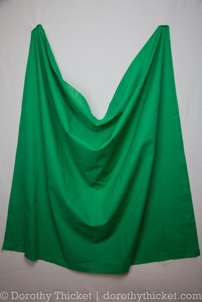 a green cloth hanging on the wall