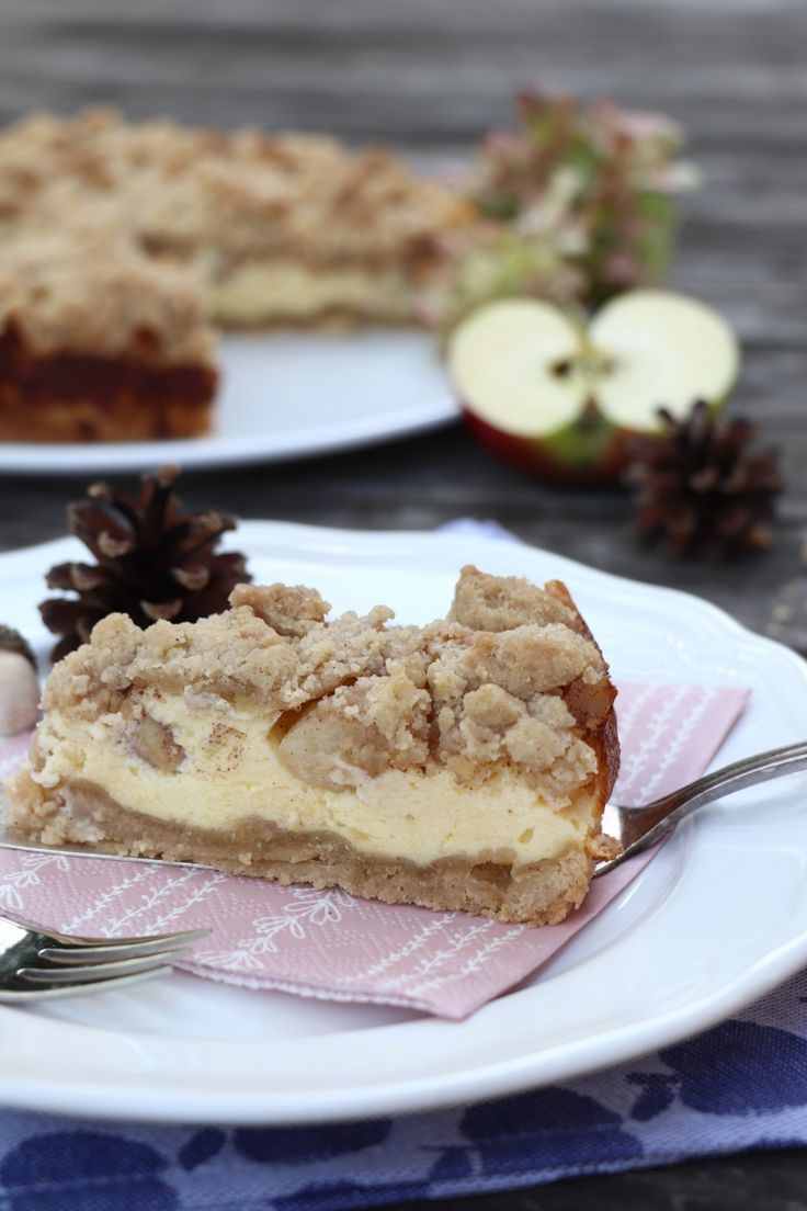 a slice of pie sitting on top of a white plate next to an apple pie