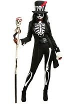 a woman dressed in black and white holding a skeleton stick while wearing a top hat