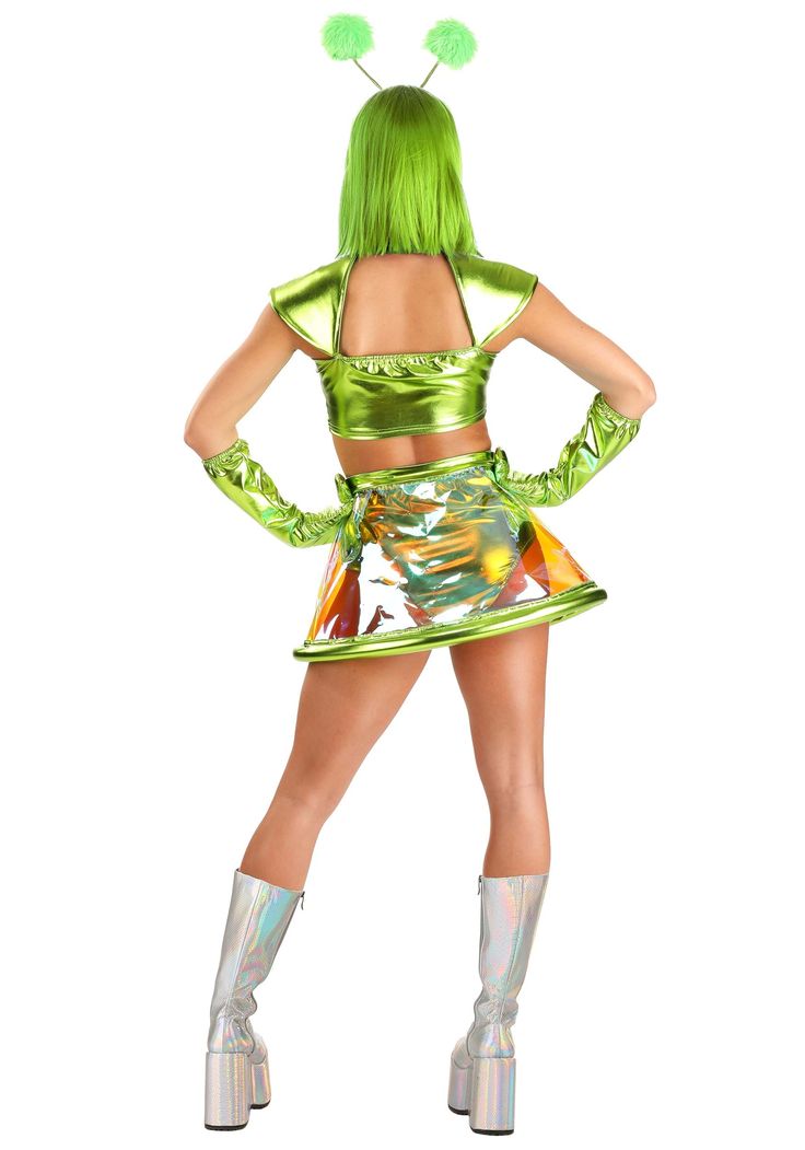 a woman in a green costume is posing