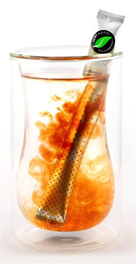 a glass jar filled with liquid and a toothbrush in it's mouth on a white background