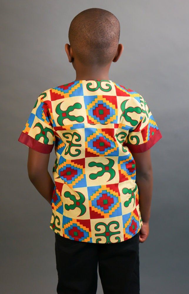 This short sleeved African Kente shirt is real cute. Dress him up in this cute African outfit and he will attract a lot of attention and draw tons of compliments. He can wear it whenever he wants to project his African Identity. He can wear it during Sankofa, Kwanzaa, and any African American or Afrocentric Cultural event. *Hand Sewn African Dress *Made by Local Artisans in Africa *100% Cotton *Made in Ghana *Portions of proceeds donated to charities in Africa *Everything in stock is available i Printed Cotton Half Sleeve T-shirt, Casual Multicolor Print T-shirt, Casual Multicolor Patterned T-shirt, Casual Multicolor T-shirt With Colorful Pattern, Casual Short Sleeve Patchwork T-shirt, Casual Patchwork Short Sleeve T-shirt, Casual Patterned Cotton Sets, Casual Multicolor Print T-shirt With Colorful Pattern, Casual T-shirt With Colorful Multicolor Print