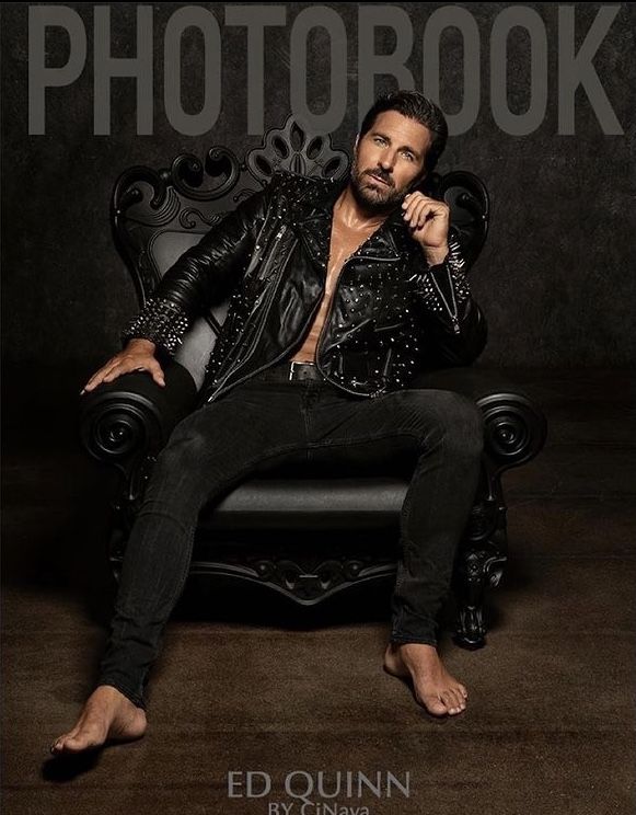 a man sitting on top of a chair in front of a black background with the words photobook