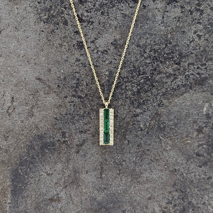 Discover the beauty and elegance of our Emerald and Diamond Necklace. Made with 14k yellow gold, this necklace features stunning emeralds and 0.10ct diamond, adding a touch of luxury to any outfit. The 16-18" chain is secured with a spring ring clasp for ease and comfort. Elevate your style with this timeless piece. Classic Diamond-cut Emerald Necklace, Classic Emerald-cut Diamond Emerald Necklace, Luxury Faceted Emerald Necklace Gift, Luxury Fine Jewelry: Polished Emerald Necklace, Luxury 14k Gold Emerald-cut Emerald Necklace, Emerald And Diamond Necklace, Sterling Silver Jewelry Earrings, Charm Rings, Chains For Men