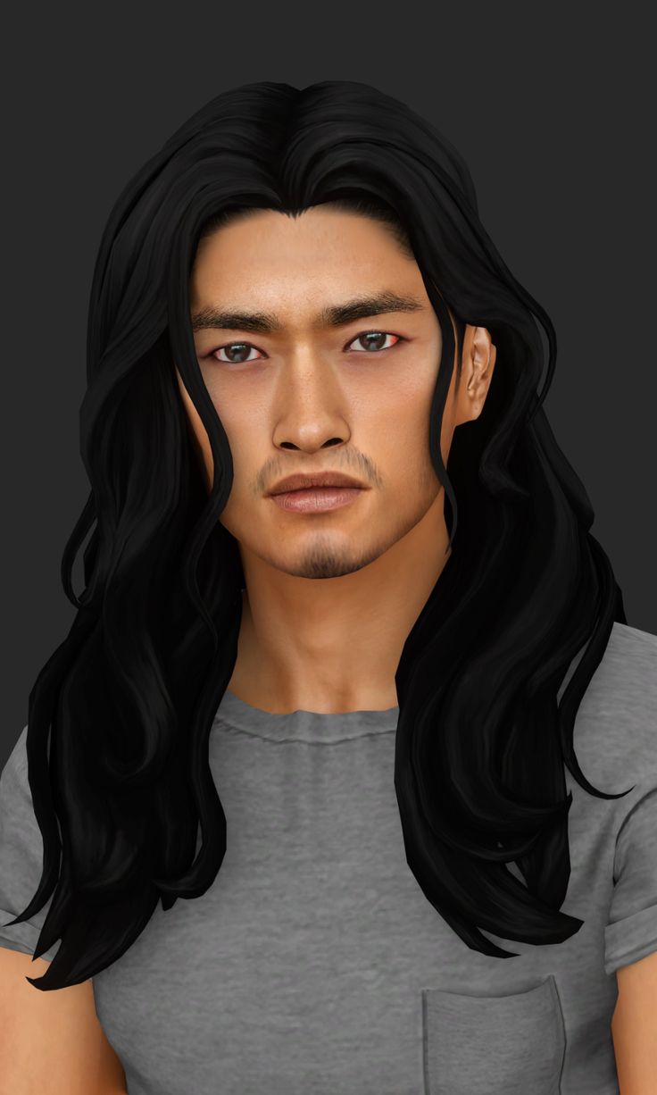 a man with long black hair wearing a gray shirt