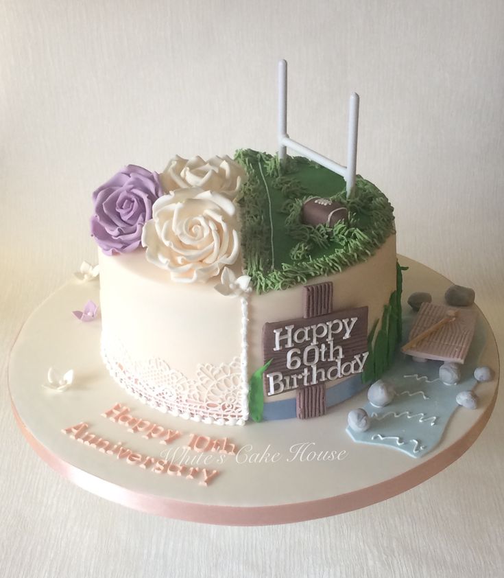 a birthday cake decorated with flowers and flags