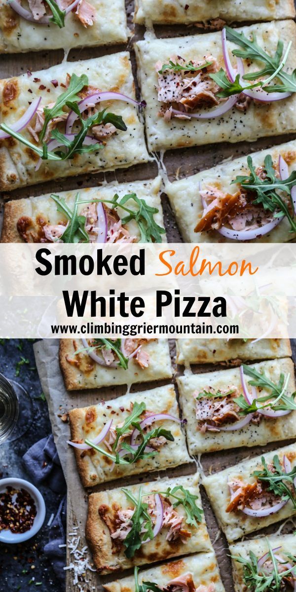 smoked salmon, white pizza with herbs on top and in the middle cut into squares