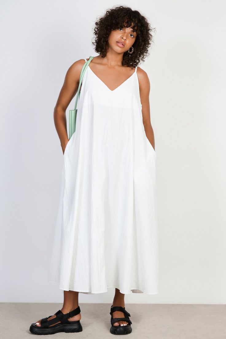 White V neck floaty midi dress Spring A-line Flowy Midi Dress, Chic A-line Tea Length Summer Dress, Casual A-line Maxi Dress Unlined, White V-neck Maxi Dress For Summer, Chic A-line Sundress For Daywear, Summer V-neck Relaxed Fit Dress, Chic Summer Maxi V-neck Dress, Relaxed Fit V-neck Sundress Midi Dress, Flowy Midi Length V-neck Dress For Vacation